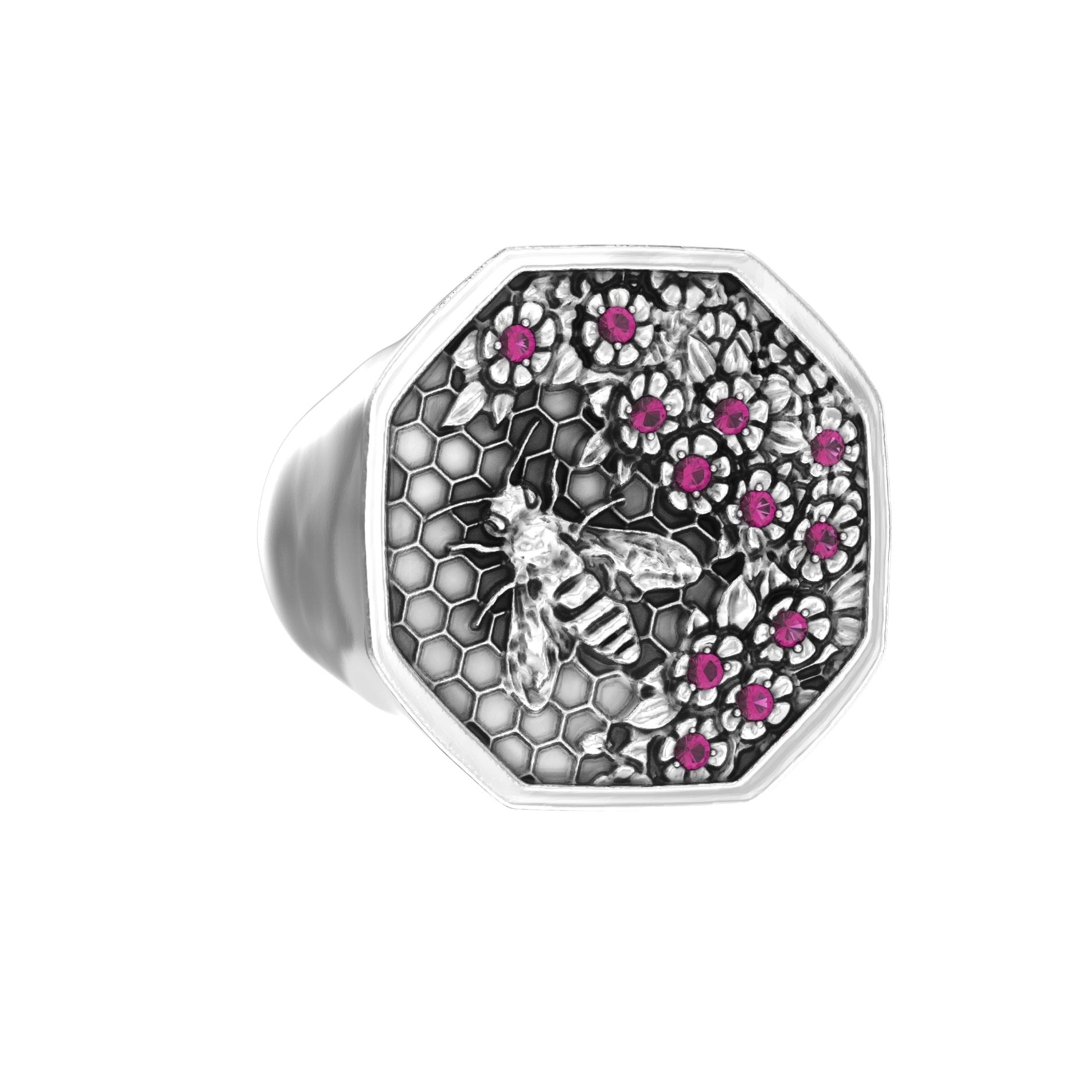 Angled left view of sterling silver signet ring featuring bee motif and ruby accents
