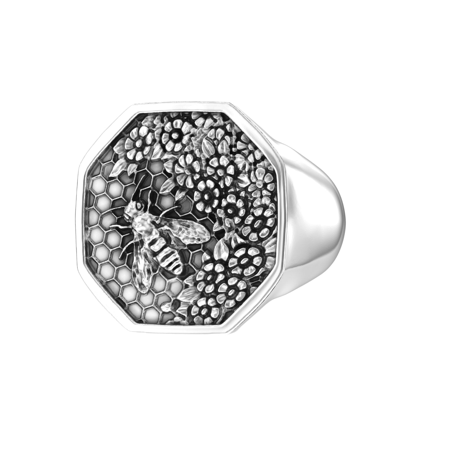 Angled right view of sterling silver bee signet ring with engraved floral honeycomb design