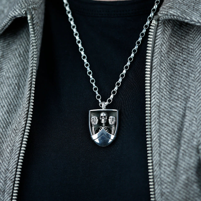 The Duality Pendant in sterling silver by BeckonJewel – handcrafted skeleton design holding masks of joy and sorrow, symbolising balance, resilience and authenticity