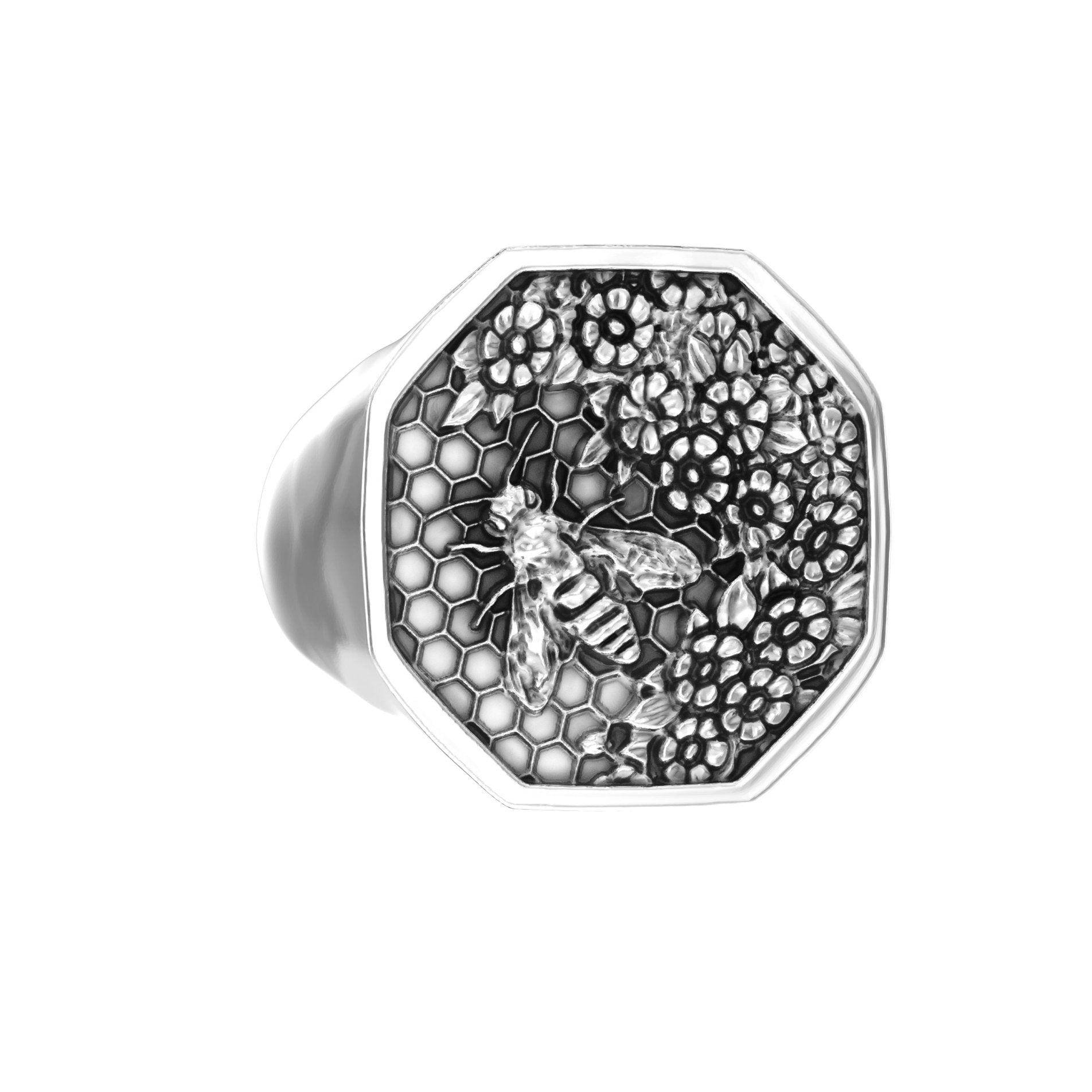 Angled left view of sterling silver bee signet ring with engraved floral honeycomb design